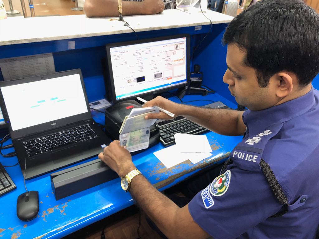 Immigration Police scanning with MIND Devices at Shahjalal International Airport